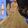 Gold Toned Bridal Naziaa Beige Lehenga With 3D FLoral Embroidery And An Embroidered Shoulder Rest