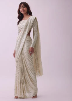 Off-White Sequins Saree And Blouse With Cowl Sleeves And Tassels